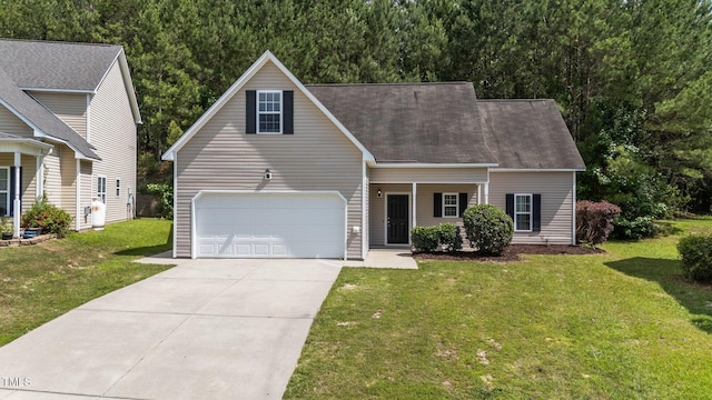 633 Prickly Pear Dr, Fuquay Varina, NC 27526 - view of front of home with driveway, a front lawn, a garage, and a shingled roof