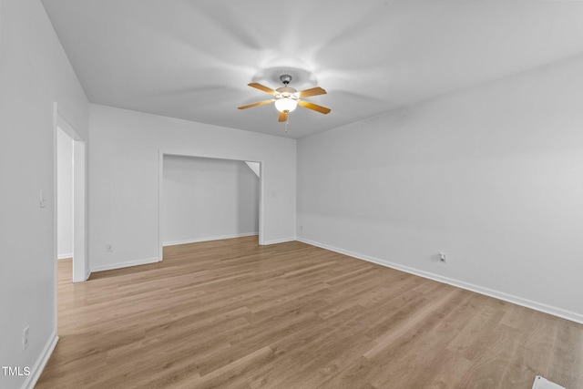 633 Prickly Pear Dr, Fuquay Varina, NC 27526 - unfurnished bedroom with baseboards, light wood finished floors, a closet, and a ceiling fan