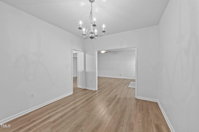 633 Prickly Pear Dr, Fuquay Varina, NC 27526 - unfurnished dining area with a chandelier, light wood-type flooring, and baseboards