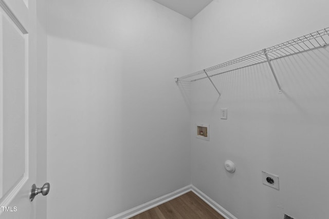 633 Prickly Pear Dr, Fuquay Varina, NC 27526 - laundry room featuring hookup for a washing machine, hookup for an electric dryer, dark wood-type flooring, baseboards, and hookup for a gas dryer
