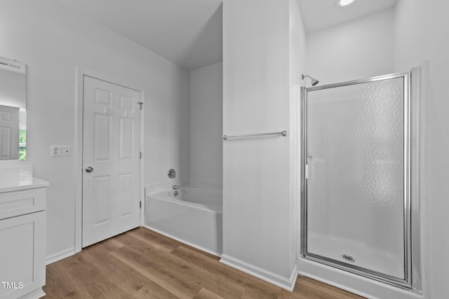 633 Prickly Pear Dr, Fuquay Varina, NC 27526 - full bath with a shower stall, vanity, wood finished floors, a bath, and baseboards