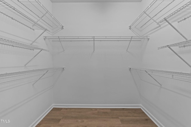 633 Prickly Pear Dr, Fuquay Varina, NC 27526 - walk in closet featuring dark wood-style flooring