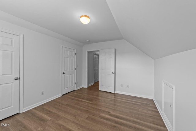 633 Prickly Pear Dr, Fuquay Varina, NC 27526 - additional living space featuring wood finished floors, vaulted ceiling, and baseboards