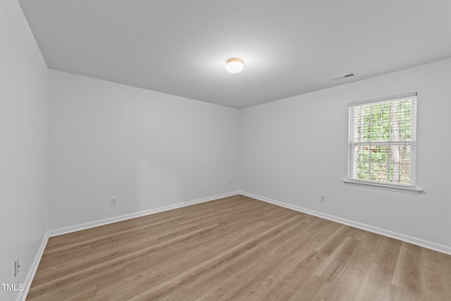 633 Prickly Pear Dr, Fuquay Varina, NC 27526 - spare room featuring wood finished floors and baseboards