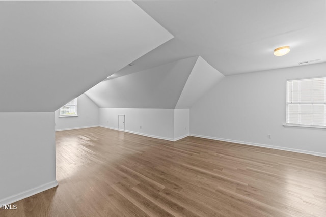 633 Prickly Pear Dr, Fuquay Varina, NC 27526 - bonus room with wood finished floors, baseboards, and lofted ceiling