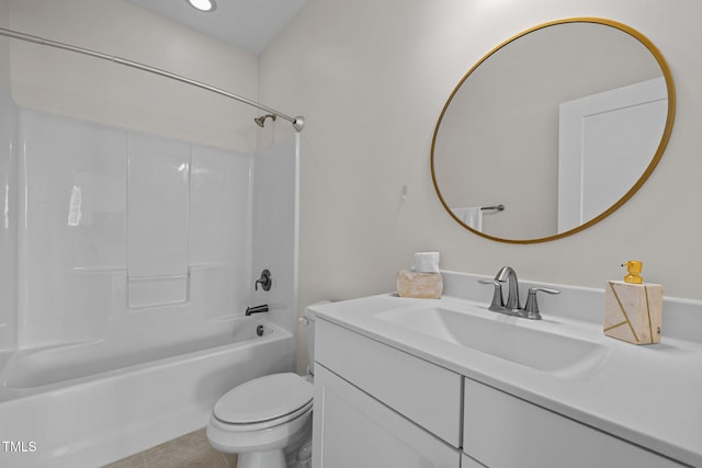 bathroom featuring vanity, tile patterned floors, toilet, and shower / washtub combination