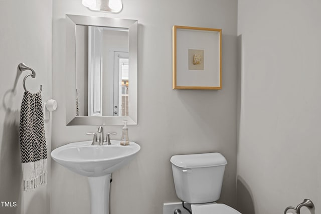half bath featuring toilet