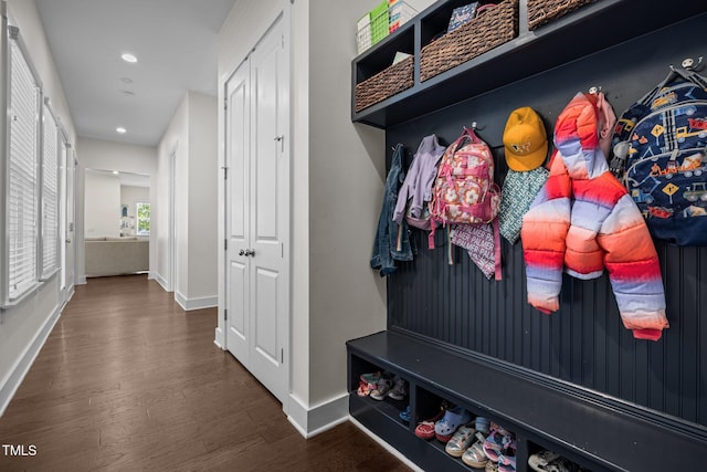 mudroom with baseboards, recessed lighting, and wood finished floors