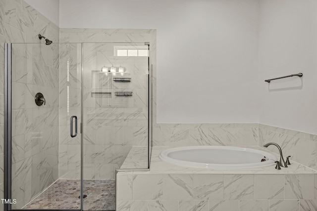 bathroom featuring a garden tub and a stall shower