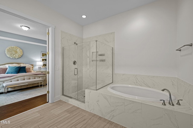 full bathroom with recessed lighting, a marble finish shower, ensuite bath, and a bath