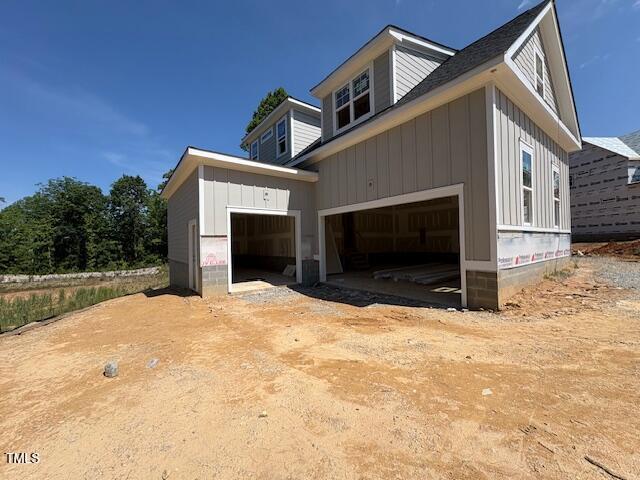 348 Inspiration Way, Fuquay Varina, NC 27526 - view of side of property featuring a garage and board and batten siding