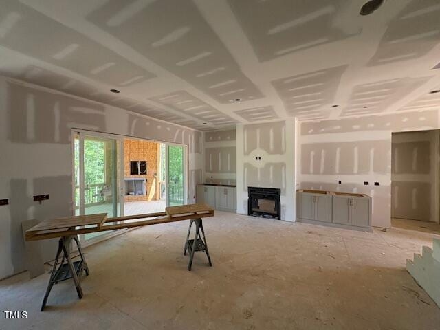 348 Inspiration Way, Fuquay Varina, NC 27526 - unfurnished living room featuring a fireplace
