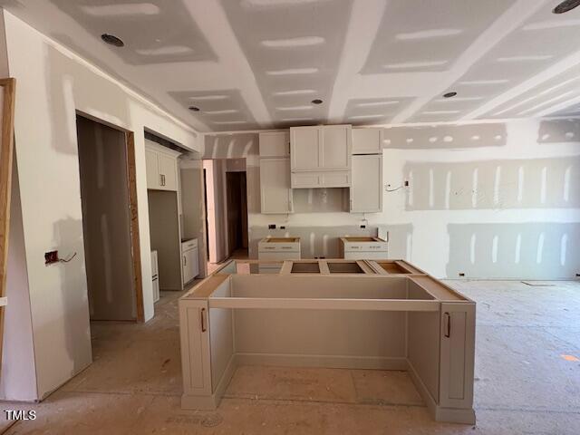 348 Inspiration Way, Fuquay Varina, NC 27526 - kitchen with a kitchen island and white cabinets
