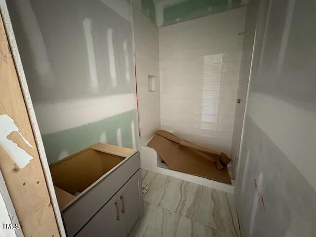 348 Inspiration Way, Fuquay Varina, NC 27526 - bathroom featuring a stall shower, marble finish floors, and vanity