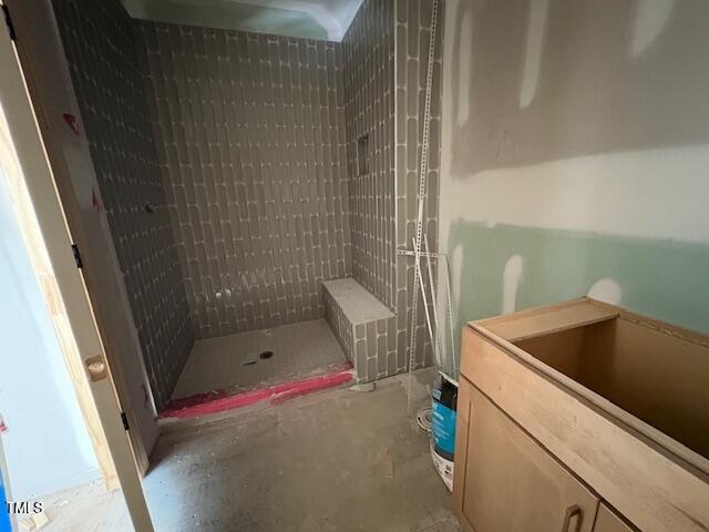348 Inspiration Way, Fuquay Varina, NC 27526 - bathroom featuring unfinished concrete floors and tiled shower