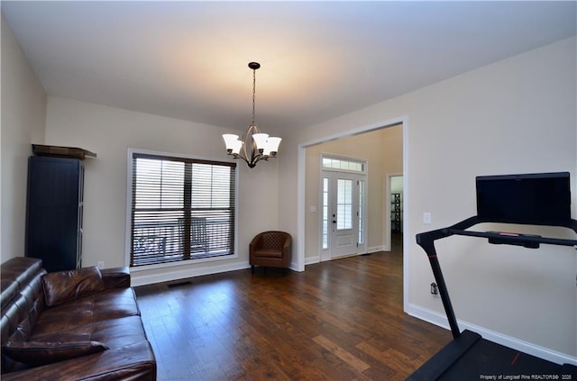 6226 Deerstand Rd, Wade, NC 28395 - workout room featuring wood finished floors, a chandelier, and baseboards