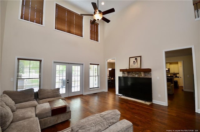 6226 Deerstand Rd, Wade, NC 28395 - living area featuring ceiling fan, a high ceiling, dark wood-style floors, baseboards, and french doors