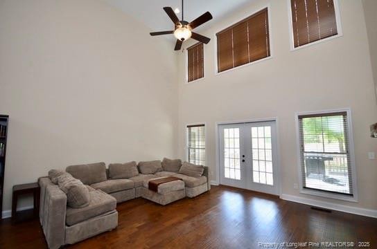 6226 Deerstand Rd, Wade, NC 28395 - living area featuring high vaulted ceiling, a ceiling fan, wood finished floors, french doors, and baseboards