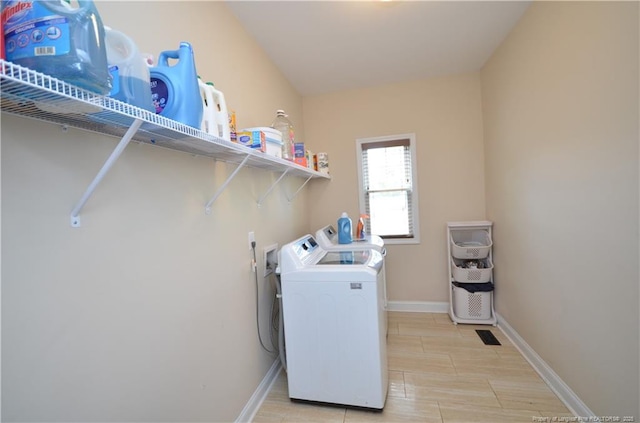 6226 Deerstand Rd, Wade, NC 28395 - washroom with separate washer and dryer, baseboards, and light wood-style floors