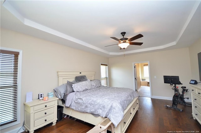 6226 Deerstand Rd, Wade, NC 28395 - bedroom with a raised ceiling, dark wood-style floors, baseboards, and ceiling fan