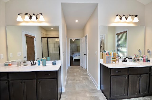 6226 Deerstand Rd, Wade, NC 28395 - bathroom featuring two vanities, a shower stall, ensuite bath, baseboards, and recessed lighting