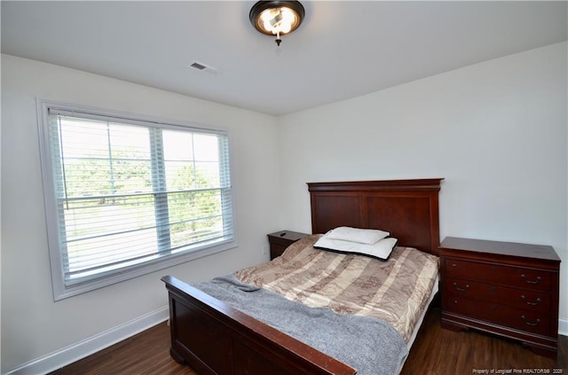 6226 Deerstand Rd, Wade, NC 28395 - bedroom with dark wood finished floors and baseboards