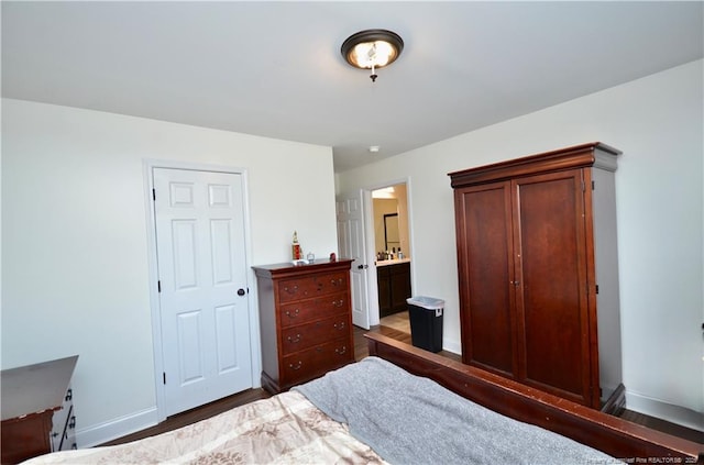 6226 Deerstand Rd, Wade, NC 28395 - bedroom featuring baseboards, wood finished floors, and ensuite bathroom