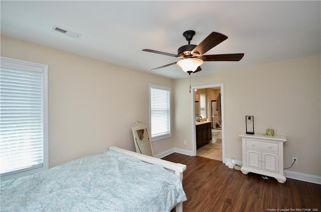 6226 Deerstand Rd, Wade, NC 28395 - bedroom with dark wood finished floors, baseboards, ceiling fan, and ensuite bathroom