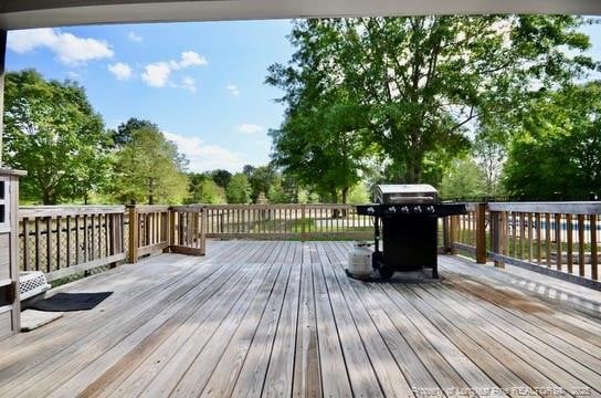 6226 Deerstand Rd, Wade, NC 28395 - wooden deck with view of wooded area