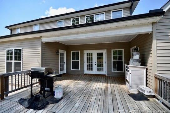 6226 Deerstand Rd, Wade, NC 28395 - wooden deck with french doors and area for grilling