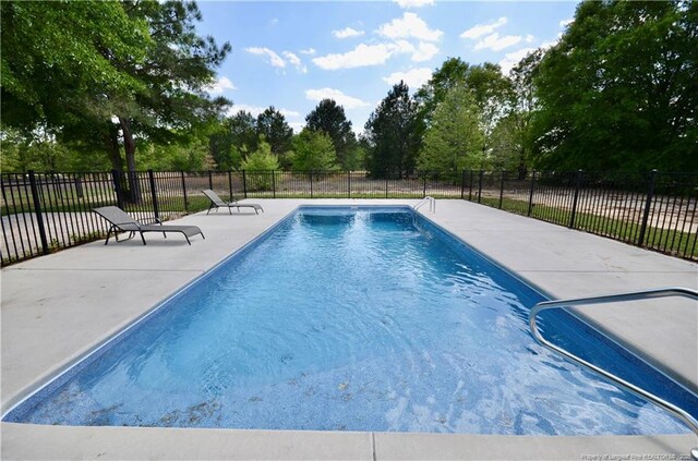 6226 Deerstand Rd, Wade, NC 28395 - view of swimming pool featuring a patio and view of scattered trees