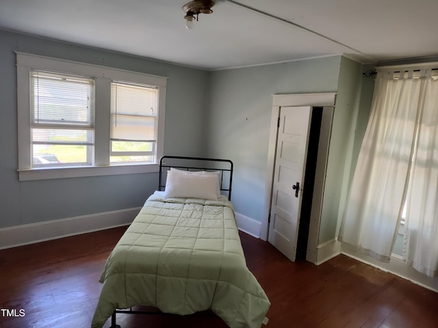 303 Wilcox St, Warrenton, NC 27589 - bedroom with dark wood finished floors and baseboards