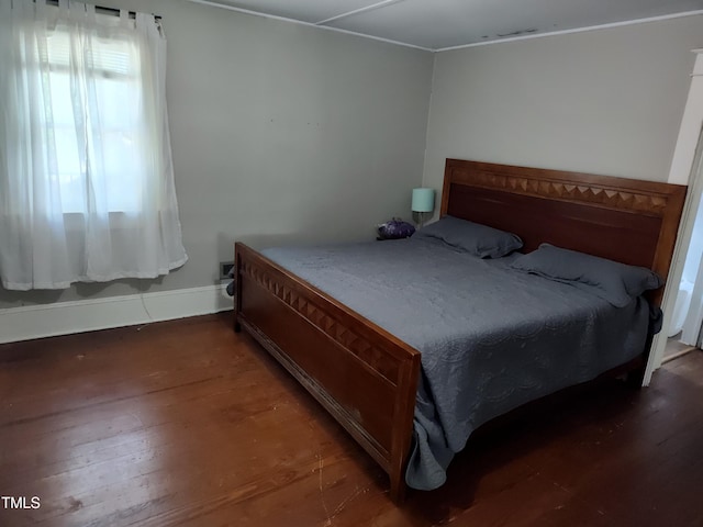 303 Wilcox St, Warrenton, NC 27589 - bedroom featuring wood finished floors and baseboards