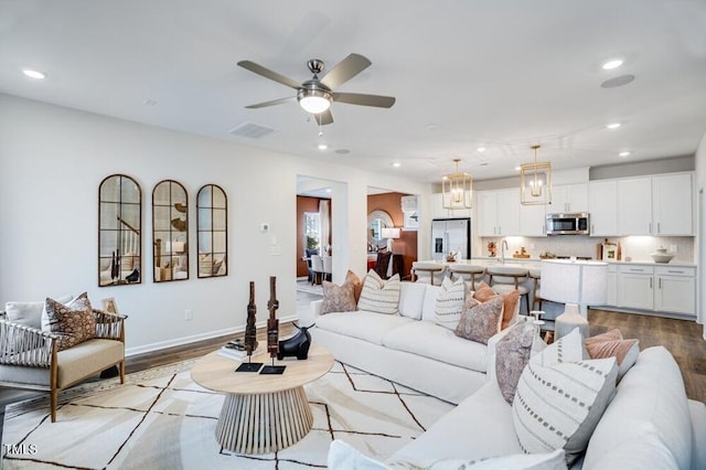 1248 Hardin Hill Ln, Knightdale, NC 27545 - living area with a ceiling fan, wood finished floors, visible vents, and recessed lighting