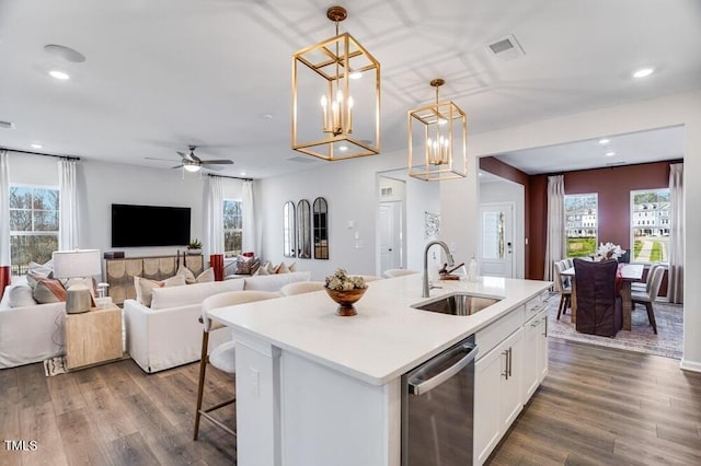 1248 Hardin Hill Ln, Knightdale, NC 27545 - kitchen with dishwasher, white cabinetry, a sink, and a healthy amount of sunlight