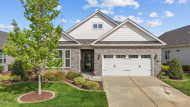 1047 Aberlour Ln, Burlington, NC 27215 - craftsman inspired home with an attached garage, board and batten siding, driveway, stone siding, and a front yard