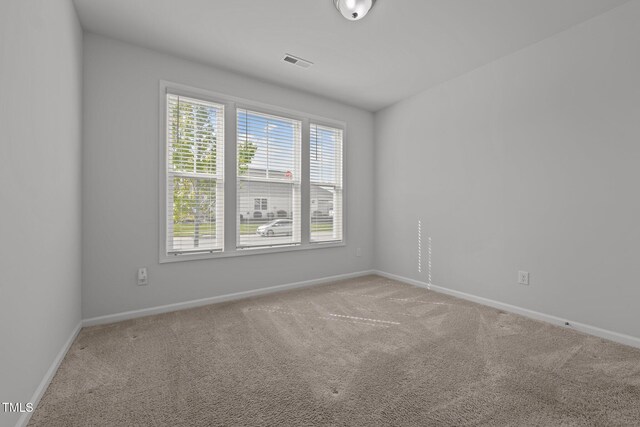 1047 Aberlour Ln, Burlington, NC 27215 - carpeted spare room featuring visible vents and baseboards