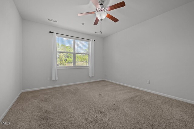 1047 Aberlour Ln, Burlington, NC 27215 - carpeted spare room featuring visible vents, a ceiling fan, and baseboards