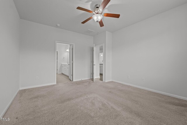 1047 Aberlour Ln, Burlington, NC 27215 - unfurnished bedroom with light colored carpet, baseboards, ensuite bath, and visible vents