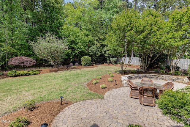 view of yard with a fenced backyard and a patio area