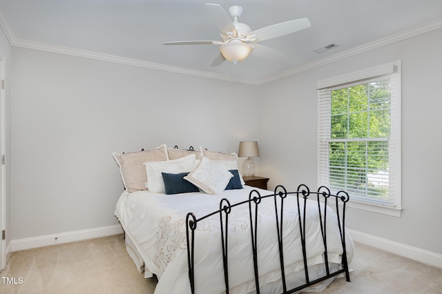 carpeted bedroom with baseboards, ornamental molding, visible vents, and multiple windows
