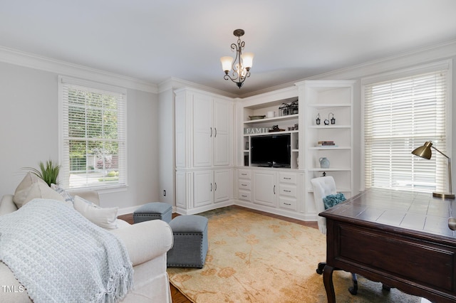 living room featuring baseboards, ornamental molding, and a notable chandelier