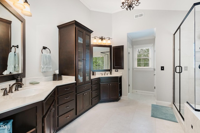 bathroom featuring crown molding, tile patterned flooring, a stall shower, and visible vents