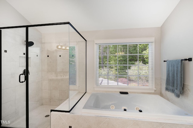 full bath with a whirlpool tub and a shower stall