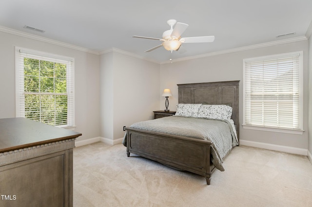 bedroom with visible vents, baseboards, crown molding, and light carpet
