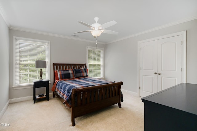 bedroom featuring baseboards, ornamental molding, and light colored carpet