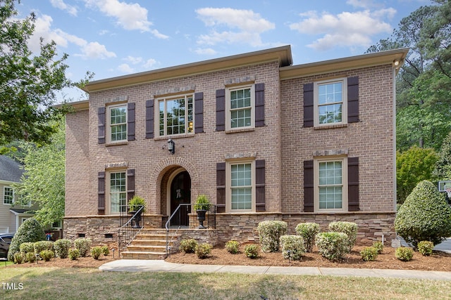 colonial house with brick siding