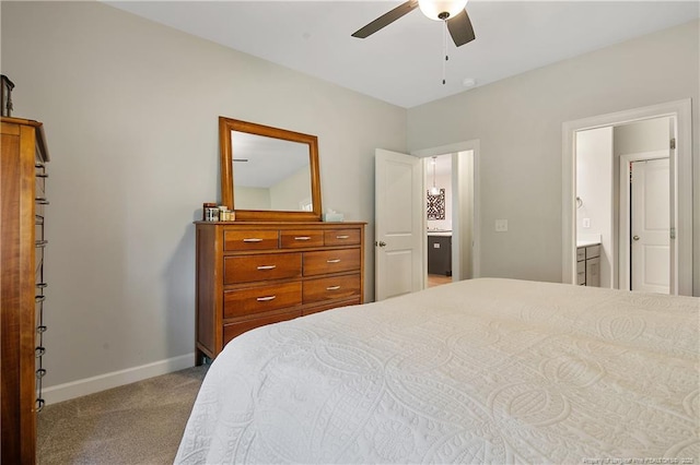 carpeted bedroom featuring a ceiling fan and baseboards