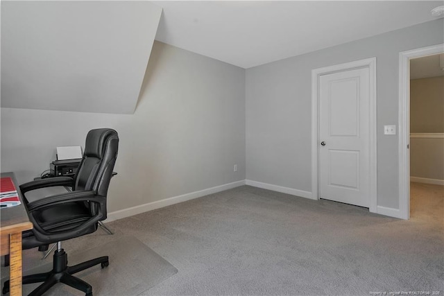 unfurnished office featuring carpet floors and baseboards
