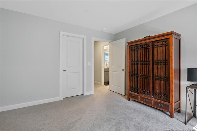 carpeted bedroom with baseboards